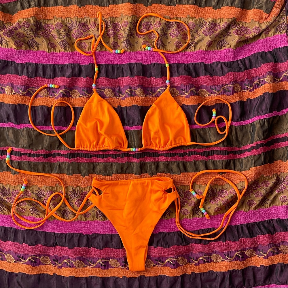 Neena swim orange bikini set with beads. Top is a S, bottoms are XS.